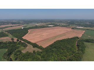 SE CORNER VIEW - SIGNIFICANT LAND & PRODUCING MINERALS AUCTION - 237 +/- SURFACE ACRES IN 4 TRACTS - 18 MINERAL PACKAGES IN GARVIN, MCCLAIN, GRADY & ROGER MILLS COUNTIES, OK - 6 Mo. AVG. CASH FLOW of $196,376/Mo.